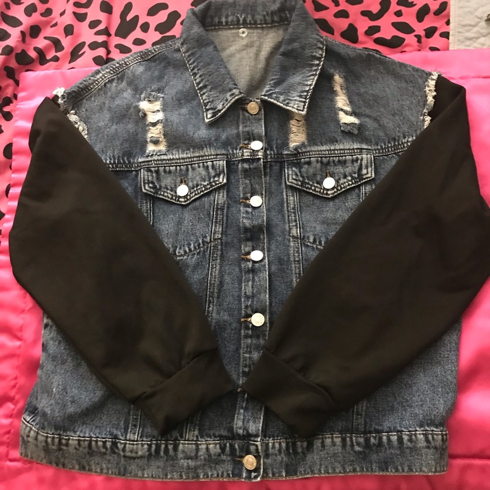 Woman’s Trendy Distressed Denim Jacket with Black Sleeves